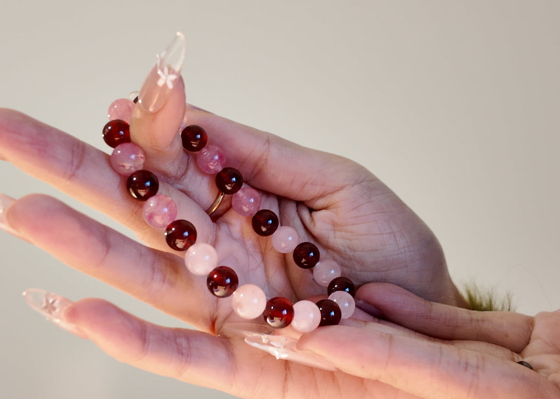 Model holding Sakura Garnet Rose Quartz love bracelet IvyBleu handmade jewelry